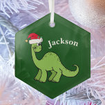 Cute Kids Christmas Dinosaur Green Personalized ガラスオーナメント<br><div class="desc">Awesome green dinosaur smiling and looking very cute in a holiday red Santa hat. I like prehistoric Christmas animals and presents that kids will love. Customize this gift with the recipient's name to make it even more personalized.</div>