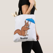 Cute red squirrel with umbrella cartoon トートバッグ (クローズアップ)