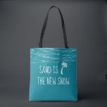 Cute Teal Tropical Sand is the New Snow Palm Tree トートバッグ<br><div class="desc">For the family that celebrates their holidays in the tropics, this pillow displays a cute palm tree icon with the sentiment fun "Sand is the New Snow." It features white chalk-styled typography set on a deep teal /aqua background with twinkling string lights. Choose the customize tool to change the background...</div>