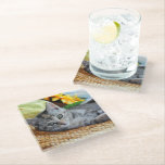 Cutest Baby Animals | Kitten Lounging ガラスコースター<br><div class="desc">This cute Getty baby animals image features a kitten lying on a mat looking at the camera with sunflowers.</div>