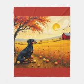 Dachshund on the farm at sunset フリースブランケット (正面)