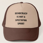 "Democracy Is Not A Spectator Sport" Trucker Hat キャップ (正面)