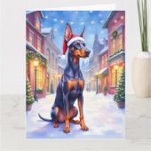 Doberman Pinscher Snowy Village Santa Hat Christma カード (正面)