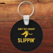 Dont Get Caught Slipng Funny Quote Banana Peel  キーホルダー (正面)