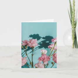 Dreamy pink carnation flowers on blue background カード