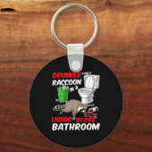 Drunk Raccoon In A Liquor Store Bathroom Funny Rac キーホルダー (正面)