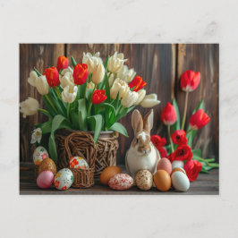 Easter bunny seated beside colorful eggs and tulip ポストカード