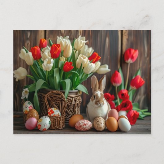 Easter bunny seated beside colorful eggs and tulip ポストカード (正面)