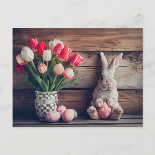 Easter bunny seated beside colorful eggs and tulip ポストカード (正面)