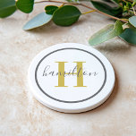 Elegant Gold Gray Round Custom Monogram Initial コースター<br><div class="desc">Elegant round personalized beverage drink coaster design features a classic custom serif monogram initial in a gold color with your last name in modern gray calligraphy script against a clean white background. A simple gray circle frames the design. Color scheme can be customized to coordinate perfectly with your home decor....</div>