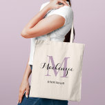 Elegant Purple Custom Wedding Bridesmaid Name トートバッグ<br><div class="desc">Elegant custom wedding tote bag features a personalized monogram typography design with modern calligraphy script name and serif monogram initial in lavender purple and black colors. Includes custom text for a bridal party title like "BRIDESMAID" or other preferred wording.</div>