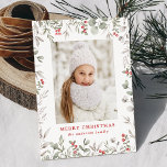 Elegant Winter Foliage and Holly Berries Photo シーズンカード<br><div class="desc">Elegant holiday card featuring your vertical photo surrounded by a border of red watercolor holly berries, eucalyptus leaves, and lush sage green foliage. Personalize the front of the botanical Christmas photo card with a custom greeting and your family name in red lettering. The card reverses to display your custom message...</div>