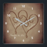 Entwined Hearts In Sepia Personalized Wedding スクエア壁時計<br><div class="desc">Romantic elegant entwined hearts in vintage sepia personalized wedding wall clock. Replace your text in the template, or delete for no text. Click on Customize to add text and change font size, style, and color. Please visit my store at Smilin' Eyes Treasures to see more flower, animal, nature, and digital...</div>