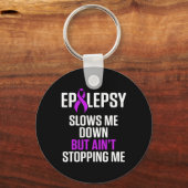 Epilepsy Awareness Slows Me Epileptic Warrior Surv キーホルダー (正面)