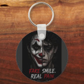 “Fake Smile, Real Pain: The Truth Behind Man キーホルダー (正面)