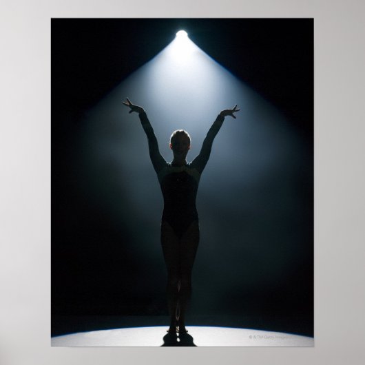 Female gymnast performing in spotlight, studio ポスター (正面)