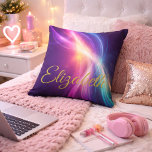 Flowing Waves of Color クッション<br><div class="desc">Make a bold and beautiful statement with this personalized light wave accent pillow, designed to capture movement, energy, and individuality. Featuring flowing waves of radiant color—blending purples, pinks, blues, and golden light—this design creates a mesmerizing sense of motion against a deep, cosmic-inspired background. The elegant gold script name adds a...</div>