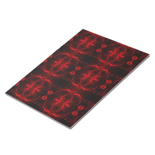 Formas em vermelho 'flutuando'sobre fundo preto. ノートパッド (アングル)