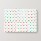 Front and back view of a white envelope  缶バッジ (正面)