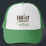 Funny easily distracted by plants bulb pot  キャップ<br><div class="desc">Easily distracted by plants, in a slightly messy distressed font like it had been playing in the dirt all day. A cute bulb in a pot is sprouting some plant magic and two orange flowers add to the design. A great gift for a gardener, plant lover, succulent enthusiast. This hat...</div>