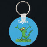 Funny green smiling animated iguana lizard キーホルダー<br><div class="desc">Iguana say Hi! This funny green lizard will add some humor to your day! Drawn in cartoon style for reptile fun!</div>