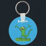 Funny green smiling animated iguana lizard キーホルダー<br><div class="desc">Iguana say Hi! This funny green lizard will add some humor to your day! Drawn in cartoon style for reptile fun!</div>