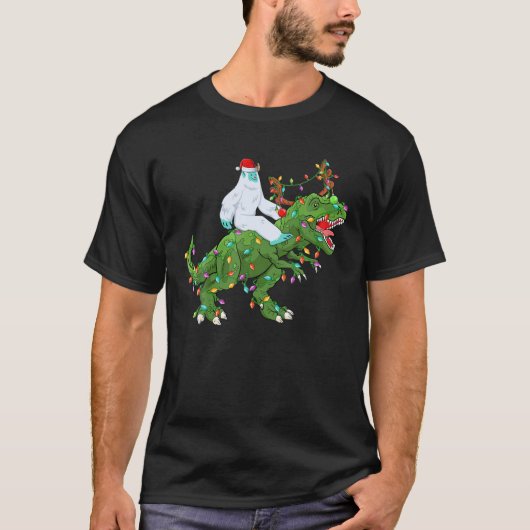Funny Xmas Lights Santa Yeti Riding Dinosaur Trex Tシャツ (正面)