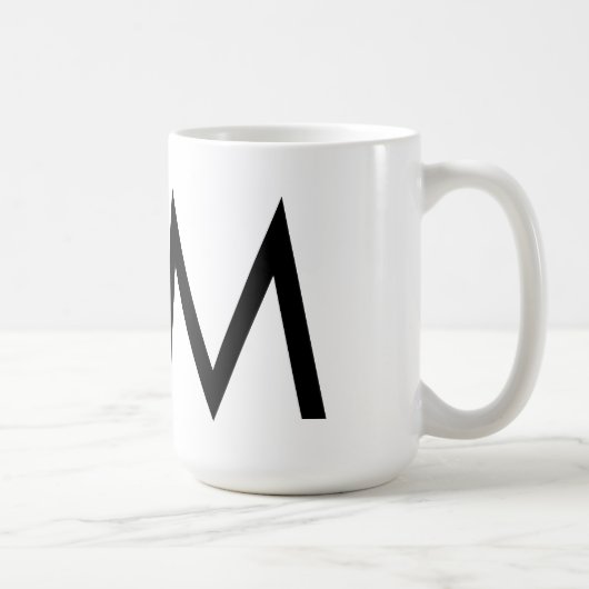 Futuraのタイポグラフィ"M"のマグ コーヒーマグカップ (右)