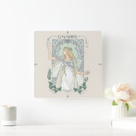 Galadriel Light of Valinor Graphic スクエア壁時計<br><div class="desc">Step into the radiant grace of Middle-Earth™ with this exquisite Lord of the Rings™ design inspired by Galadriel™. Illustrated in an elegant, Art Nouveau–inspired style, she stands poised and luminous, holding a phial of the Light of Valinor with serene strength and quiet authority. Flowing golden hair, delicate Elven adornments, and...</div>
