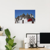Geranium flowers and trulli houses in Alberobello ポスター (ホームオフィス)