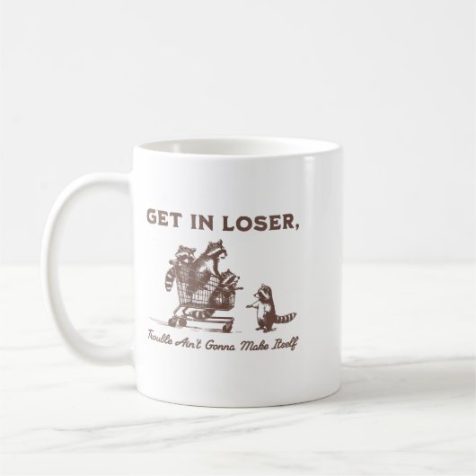 Get In Loser Trouble Aint Gonna Make Itself Funny コーヒーマグカップ (左)