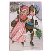 Girl and boy ice skating - Florence Hardy ミディアムペーパーバッグ (裏面)