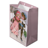 Girl and boy ice skating - Florence Hardy ミディアムペーパーバッグ (裏面アングル)