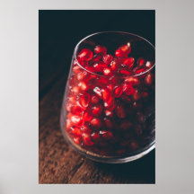 Glass full of red pomegranate seeds
