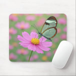Glasswing Butterfly On a Cosmos Flower マウスパッド<br><div class="desc">A delicate glasswing butterfly with transparent wings gently settles on a vibrant pink cosmos flower,  creating a dreamlike scene enhanced by a soft focus background</div>
