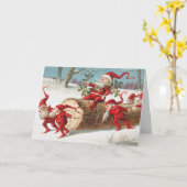 Gnomes dragging a cut tree trunk through the snow カード (黄色い花)