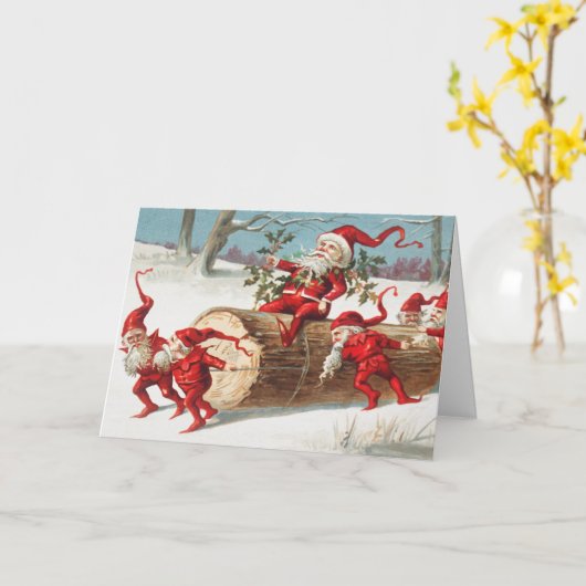 Gnomes dragging a cut tree trunk through the snow カード (黄色い花)