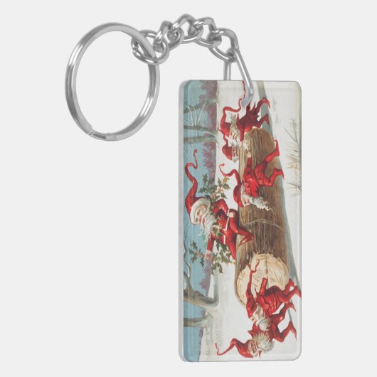 Gnomes dragging a cut tree trunk through the snow キーホルダー (正面左)