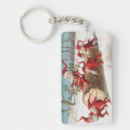 Gnomes dragging a cut tree trunk through the snow キーホルダー