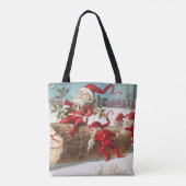 Gnomes dragging a cut tree trunk through the snow トートバッグ (裏面)