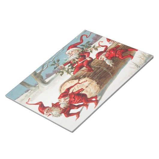 Gnomes dragging a cut tree trunk through the snow ノートパッド (アングル)