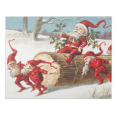 Gnomes dragging a cut tree trunk through the snow ノートパッド (正面)