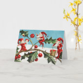 Gnomes painting holly berries in the snow カード (黄色い花)