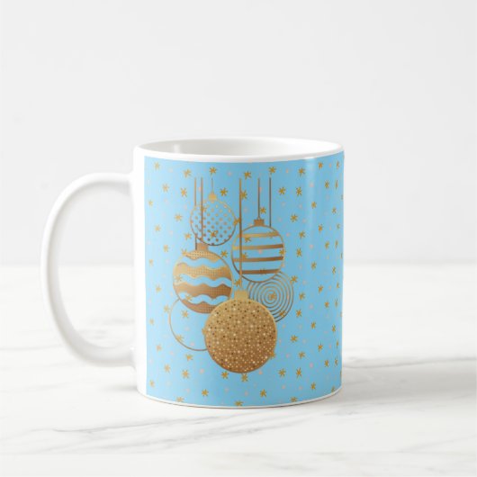 Gold baubles and stars on an ice blue background コーヒーマグカップ (左)