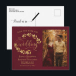 Gold Leaves Burgundy Wedding Save the Date Photo 案内ポストカード<br><div class="desc">This wedding Save the Date postcard is rustic, elegant, and beautiful. It features a hand painted watercolor design with sprigs of golden laurel leaves or vines and modern script lettering on a marbled burgundy background. There is space for your photo, the couple's name, and the wedding location. The back has...</div>