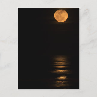 golden full moon over ocean ポストカード