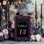 Gothic Black Raven & Black Arch Purple Wedding テーブルナンバー<br><div class="desc">Transport your guests to a world of dark, enchanting elegance with our vintage gothic wedding table number card. The deep, aged royal purple background sets the stage for a striking contrast, as bold white text emerges from intricate black text boxes. At the pinnacle of this invitation, a three-dimensional gothic border...</div>