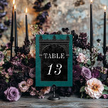 Gothic Black Raven & Black Arch Teal Wedding テーブルナンバー<br><div class="desc">Transport your guests to a world of dark, enchanting elegance with our vintage gothic wedding table number card. The deep, aged teal green background sets the stage for a striking contrast, as bold white text emerges from intricate black text boxes. At the pinnacle of this invitation, a three-dimensional gothic border...</div>
