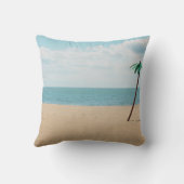 Green artificial palm tree on seashore クッション (裏面)