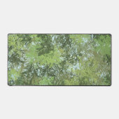 Green Leaf Trees With Blue Sky Peaking Through Art デスクマット (正面)